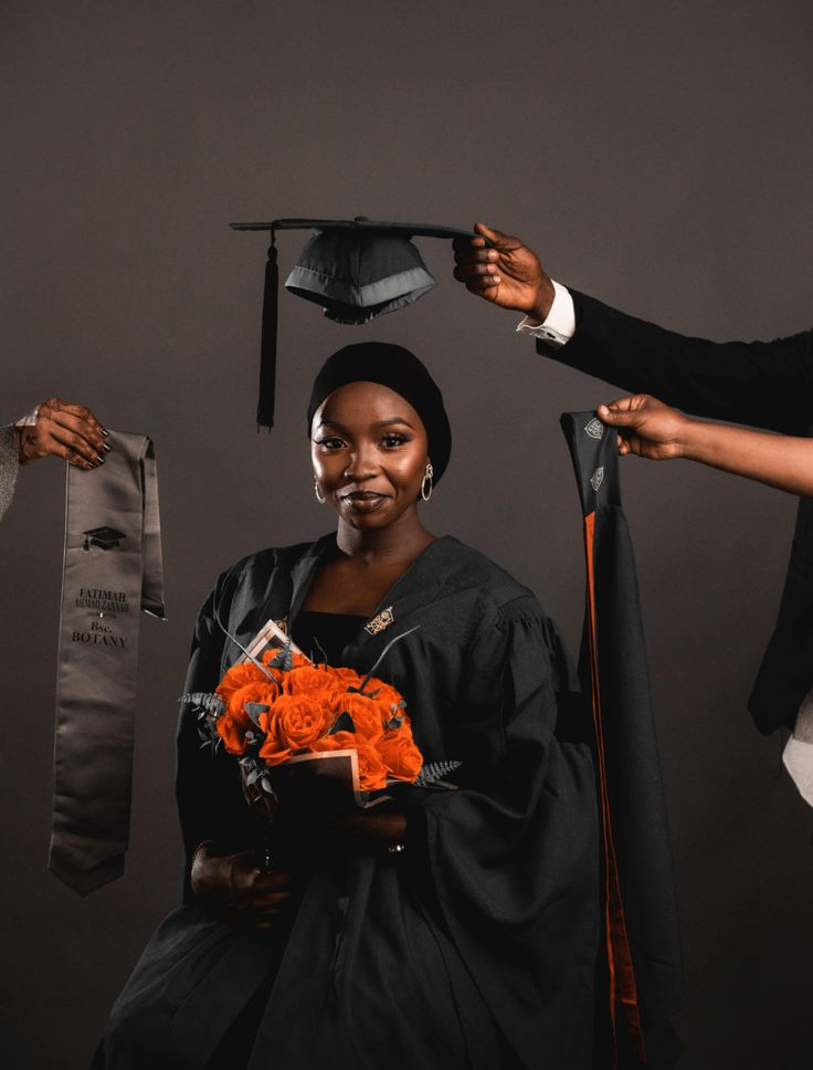 Graduate holding her cap and flowers