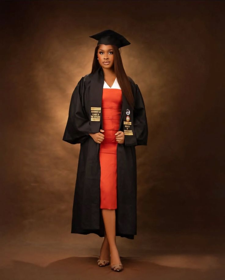 Graduate in a full-length studio portrait