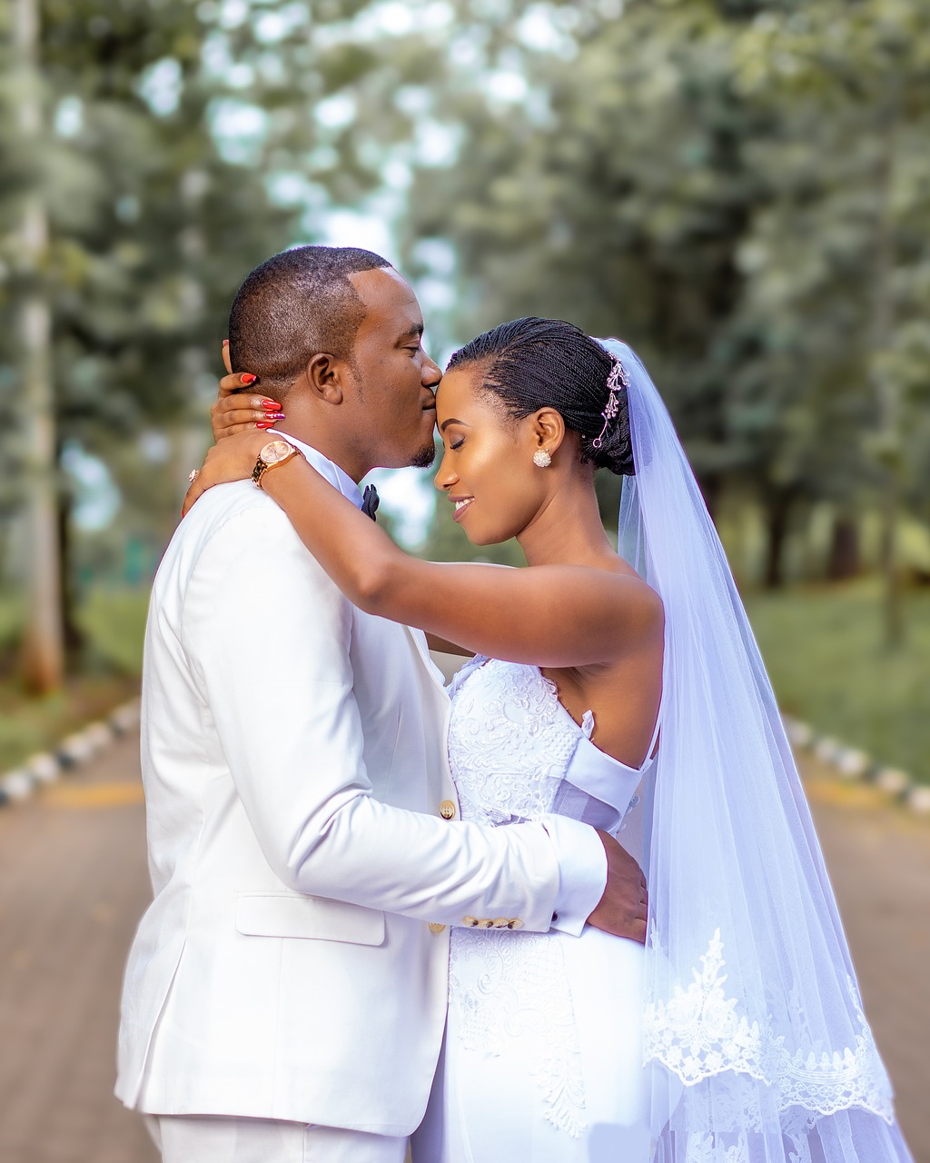 Bride and groom embracing outdoors
